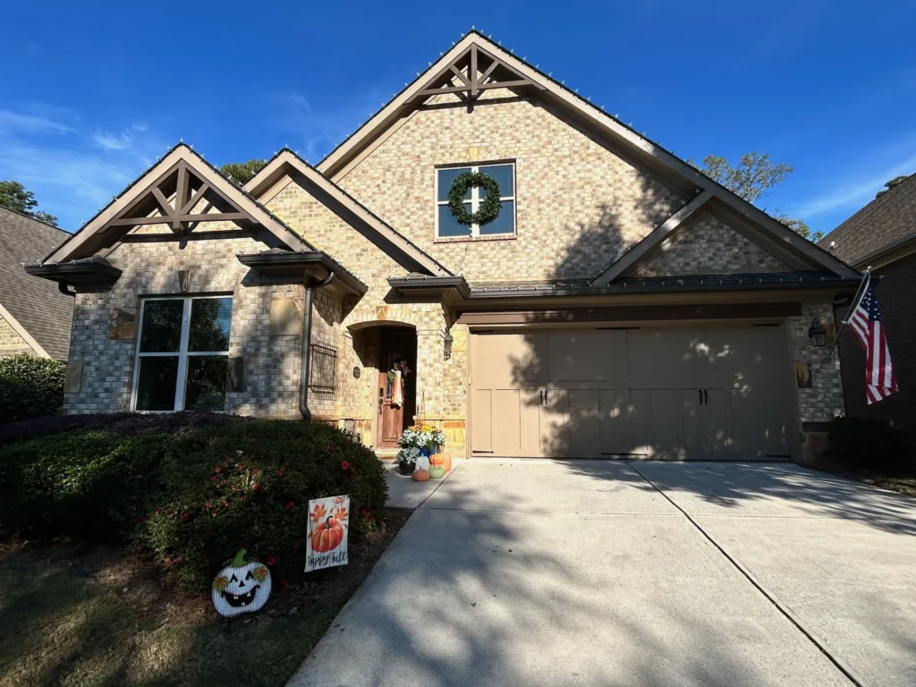 Front exterior view of a residential home used to plan roofline and entry holiday lighting.