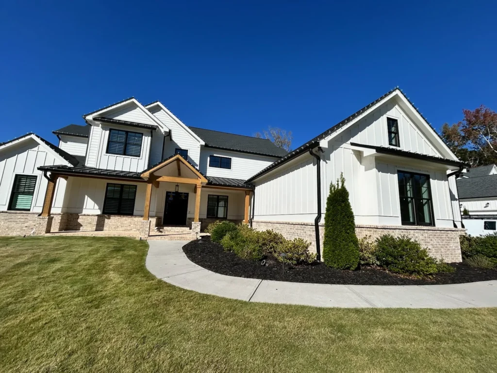 Daytime exterior of a modern residential home for custom holiday lighting design planning.