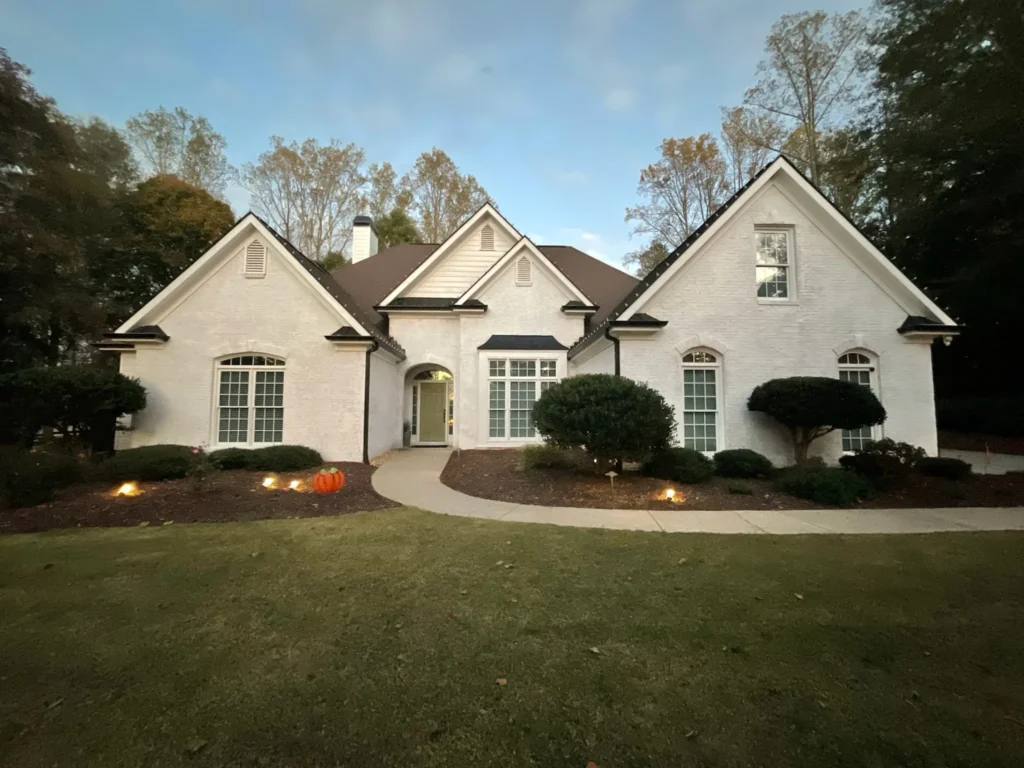 Daytime exterior view of a residential property for custom Christmas lighting design planning.